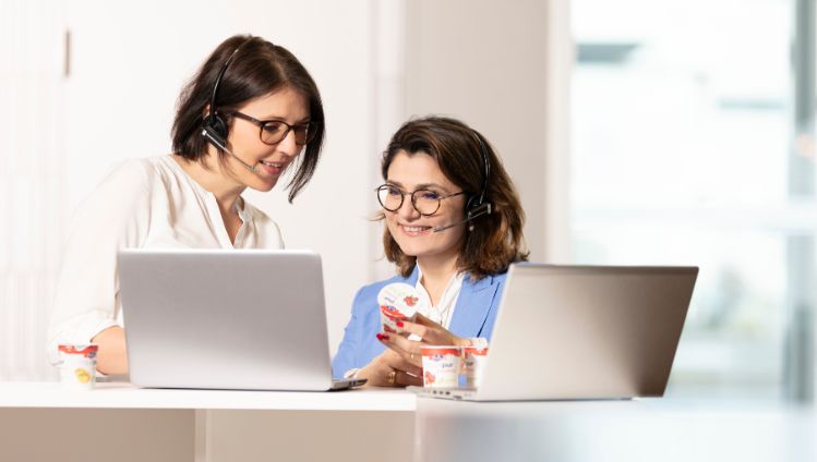 consumer-services-women-standing-desk-contact